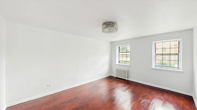 144-37 79th Ave Unit 1R, Kew Garden Hills, NY 11367 - empty room with radiator and dark wood-type flooring