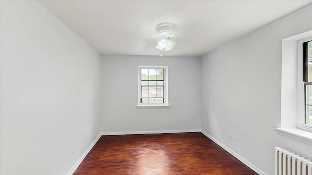 144-37 79th Ave Unit 1R, Kew Garden Hills, NY 11367 - spare room featuring radiator, ceiling fan, and wood finished floors
