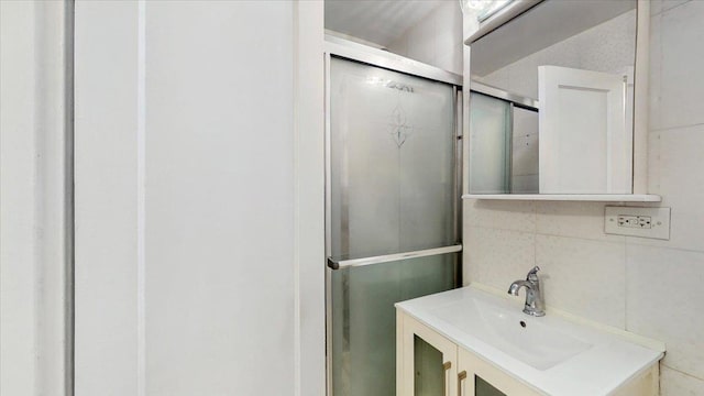 144-37 79th Ave Unit 1R, Kew Garden Hills, NY 11367 - full bath with vanity, a shower stall, and tile walls
