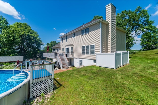 10 Von Trapp Ct, Washingtonville, NY 10992 - back of house featuring a deck, a chimney, stairway, a yard, and an outdoor pool