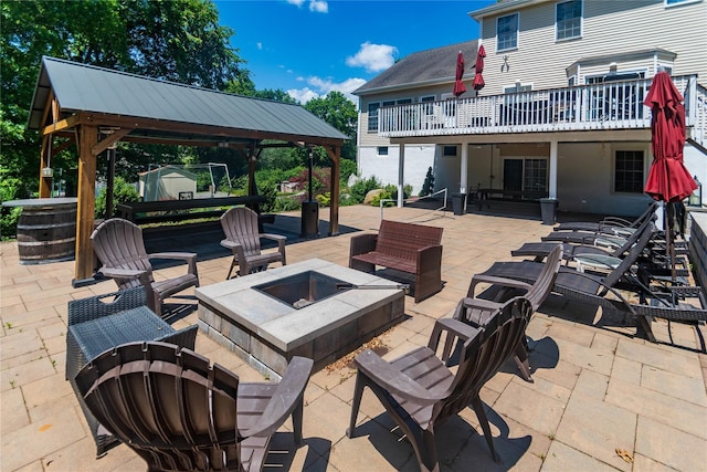 10 Von Trapp Ct, Washingtonville, NY 10992 - view of patio / terrace featuring a fire pit, a storage shed, a gazebo, and a wooden deck