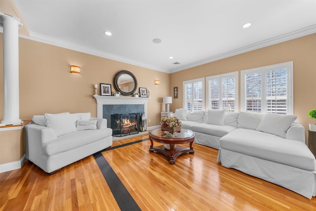 10 Von Trapp Ct, Washingtonville, NY 10992 - living room with decorative columns, light wood-style flooring, ornamental molding, a fireplace, and recessed lighting