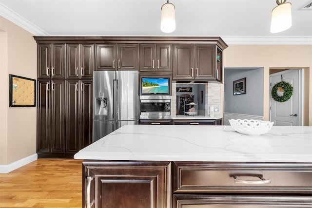 10 Von Trapp Ct, Washingtonville, NY 10992 - kitchen featuring stainless steel appliances, crown molding, dark brown cabinetry, and decorative light fixtures