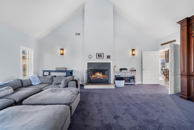 10 Von Trapp Ct, Washingtonville, NY 10992 - living area featuring high vaulted ceiling, dark colored carpet, and a tiled fireplace
