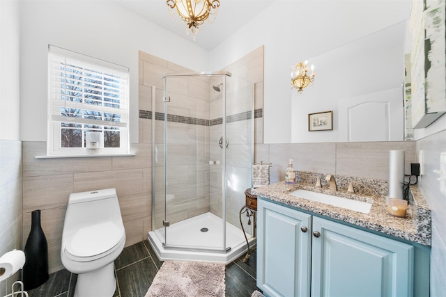 10 Von Trapp Ct, Washingtonville, NY 10992 - full bathroom with tile walls, a chandelier, vanity, and a stall shower