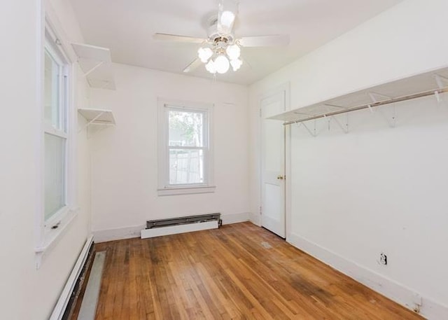 8 Gary Dr, Hyde Park, NY 12538 - spacious closet featuring a baseboard heating unit, a baseboard radiator, ceiling fan, and light wood-style floors