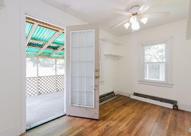 8 Gary Dr, Hyde Park, NY 12538 - entryway featuring baseboard heating, wood finished floors, and ceiling fan