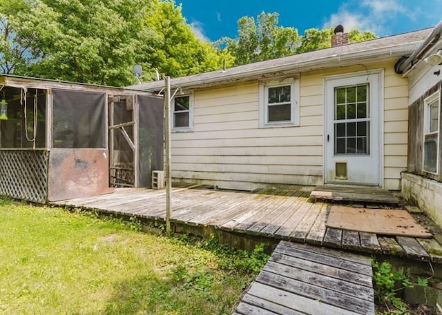 8 Gary Dr, Hyde Park, NY 12538 - back of house with a wooden deck, a chimney, and a yard