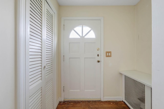 126 Carman St, Patchogue, NY 11772 - entrance foyer featuring dark wood-style floors and baseboards