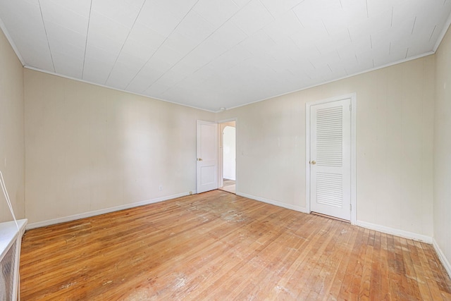 126 Carman St, Patchogue, NY 11772 - unfurnished room featuring light wood-type flooring and arched walkways