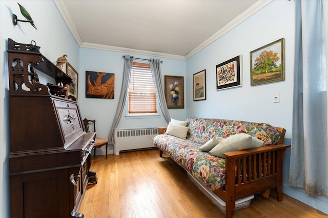 1528 Rhinelander Ave, Bronx, NY 10461 - living area with radiator, crown molding, and light wood finished floors