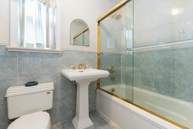 1528 Rhinelander Ave, Bronx, NY 10461 - bathroom featuring shower / bath combination with glass door and tile walls