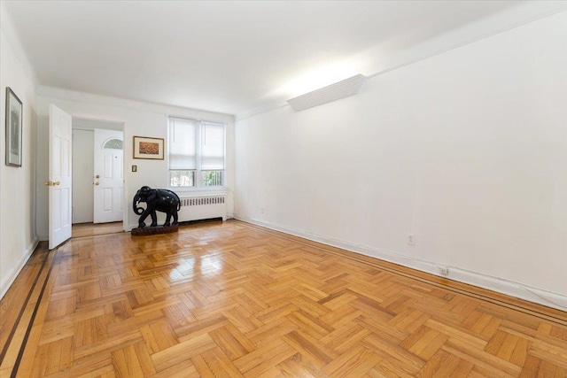 1528 Rhinelander Ave, Bronx, NY 10461 - empty room with radiator heating unit and baseboards