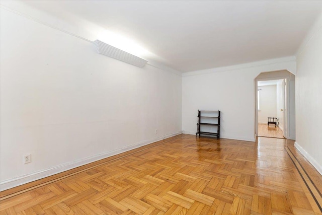 1528 Rhinelander Ave, Bronx, NY 10461 - unfurnished room featuring arched walkways and baseboards