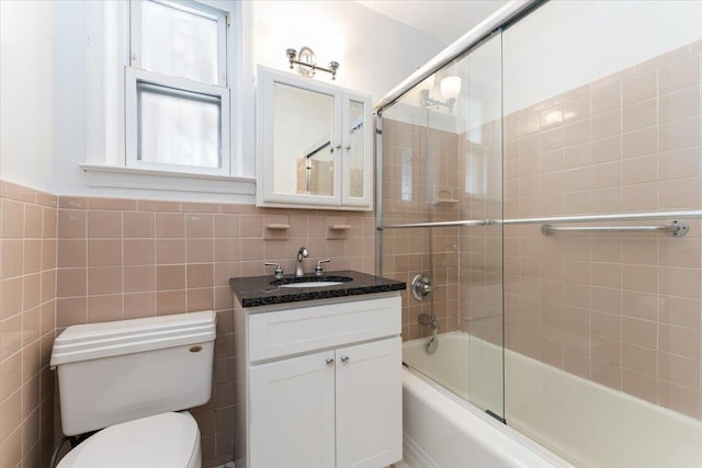1528 Rhinelander Ave, Bronx, NY 10461 - bathroom with vanity, combined bath / shower with glass door, and tile walls