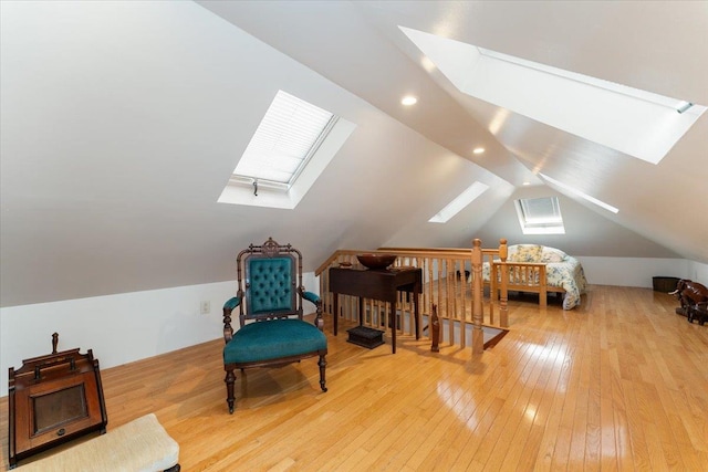 1528 Rhinelander Ave, Bronx, NY 10461 - sitting room featuring a skylight, vaulted ceiling, hardwood / wood-style floors, and an upstairs landing