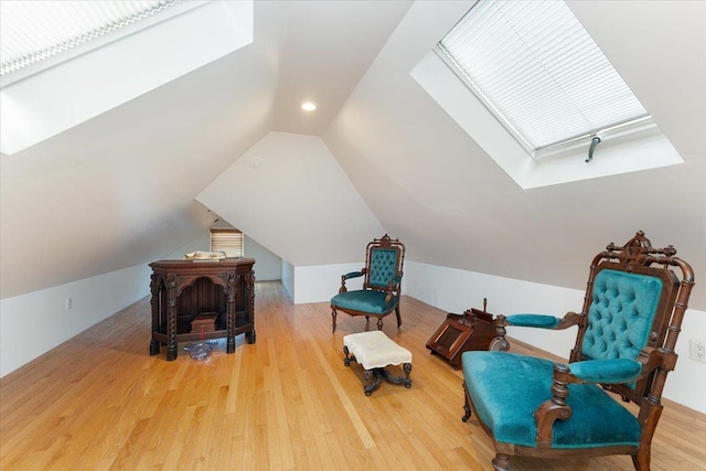 1528 Rhinelander Ave, Bronx, NY 10461 - sitting room featuring a skylight, wood finished floors, lofted ceiling, and recessed lighting