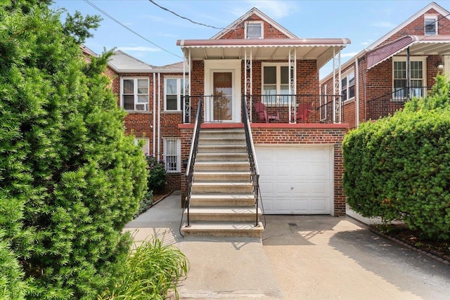 1528 Rhinelander Ave, Bronx, NY 10461 - view of front facade featuring brick siding, driveway, a garage, and a porch