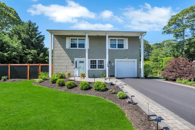 12 Turin St, East Patchogue, NY 11772 - view of front of house with driveway and a garage