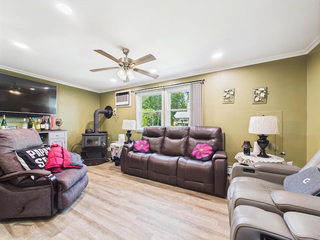12 Turin St, East Patchogue, NY 11772 - living room with a wood stove, ornamental molding, wood finished floors, ceiling fan, and a wall mounted AC