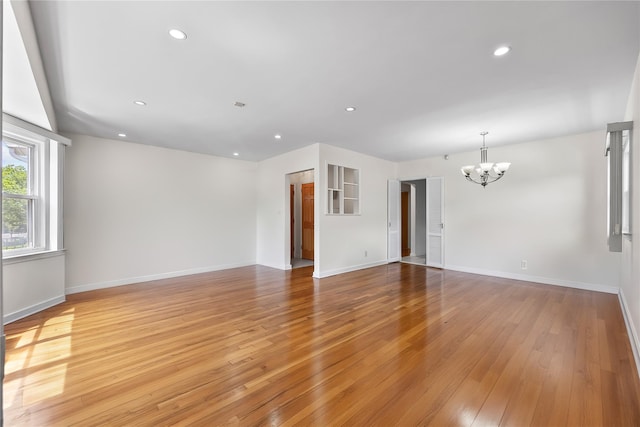 50-55 Cloverdale Blvd, Bayside, NY 11364 - spare room with a chandelier, light wood-style flooring, and recessed lighting