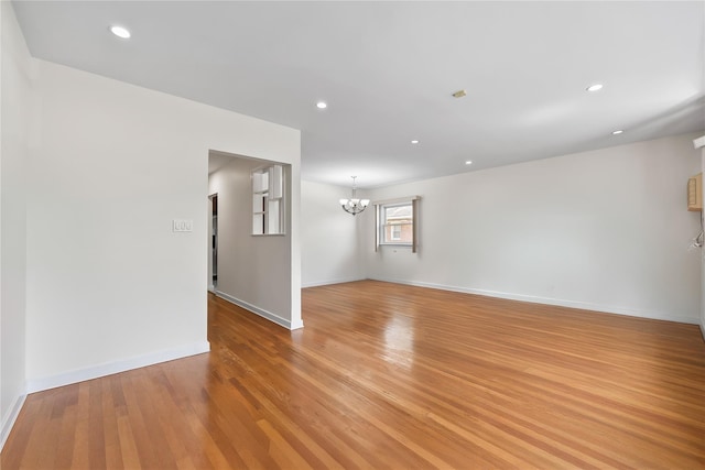50-55 Cloverdale Blvd, Bayside, NY 11364 - unfurnished room with a chandelier, light wood-type flooring, and recessed lighting