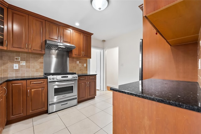 50-55 Cloverdale Blvd, Bayside, NY 11364 - kitchen with under cabinet range hood, gas range, tasteful backsplash, and glass insert cabinets