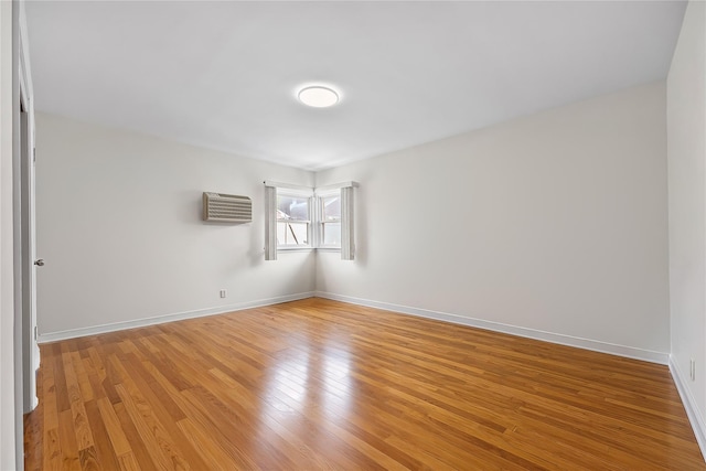 50-55 Cloverdale Blvd, Bayside, NY 11364 - spare room with a wall mounted air conditioner and light wood-type flooring