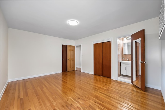 50-55 Cloverdale Blvd, Bayside, NY 11364 - unfurnished bedroom with light wood-type flooring, a closet, and ensuite bath