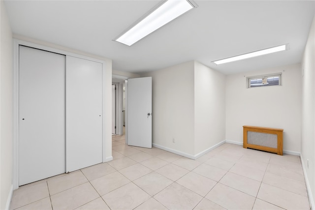 50-55 Cloverdale Blvd, Bayside, NY 11364 - unfurnished bedroom featuring a closet and light tile patterned floors