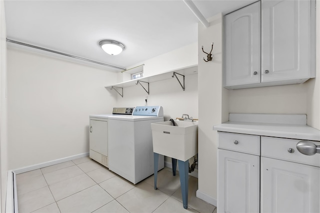 50-55 Cloverdale Blvd, Bayside, NY 11364 - laundry room with washer and clothes dryer, light tile patterned flooring, and cabinet space