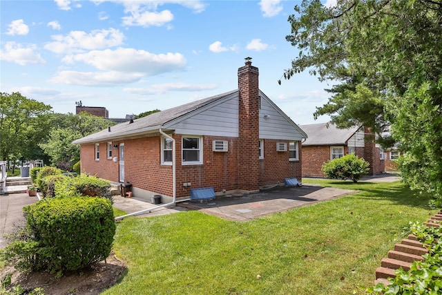 50-55 Cloverdale Blvd, Bayside, NY 11364 - view of home's exterior featuring brick siding, a patio, a chimney, and a lawn