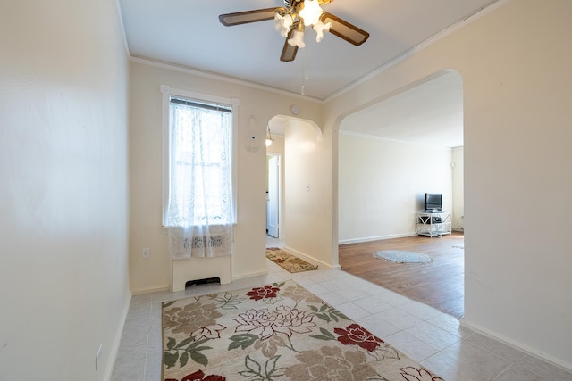 251 Seaman Ave Unit 6A, New York Manhattan, NY 10034 - tiled foyer entrance featuring arched walkways, ornamental molding, and a ceiling fan