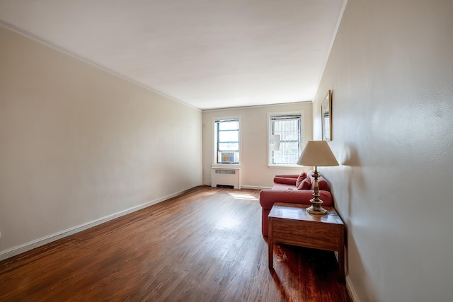 251 Seaman Ave Unit 6A, New York Manhattan, NY 10034 - sitting room featuring radiator heating unit, wood finished floors, and ornamental molding