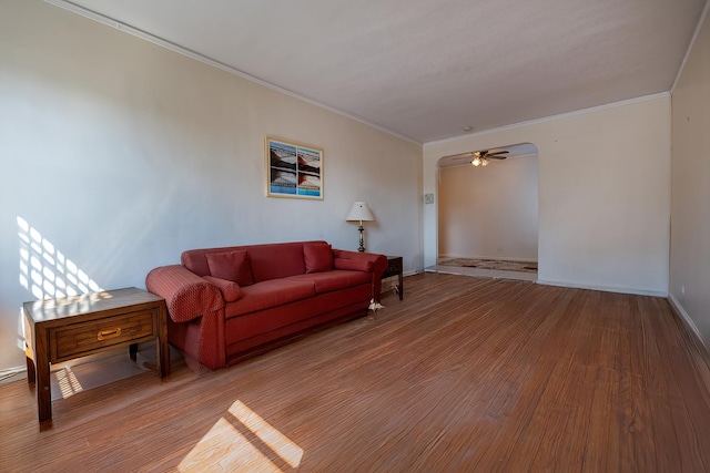 251 Seaman Ave Unit 6A, New York Manhattan, NY 10034 - living area with ornamental molding, ceiling fan, wood finished floors, and arched walkways