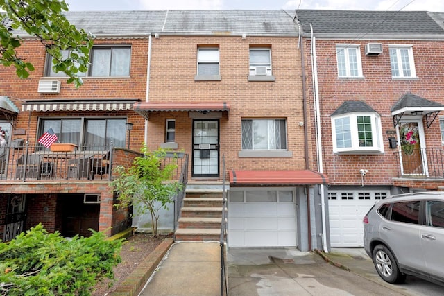 66-48 73rd Pl, Middle Village, NY 11379 - multi unit property featuring an attached garage, driveway, and brick siding
