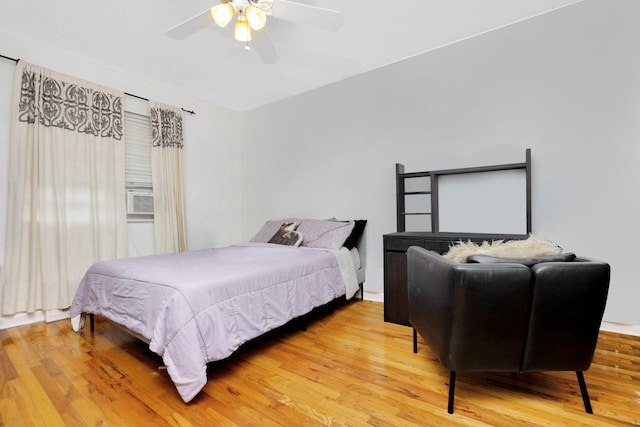 66-48 73rd Pl, Middle Village, NY 11379 - bedroom featuring wood finished floors, ceiling fan, and cooling unit