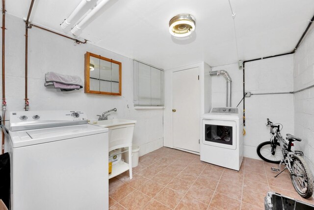 66-48 73rd Pl, Middle Village, NY 11379 - laundry room featuring independent washer and dryer and light tile patterned floors