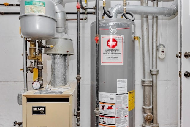 66-48 73rd Pl, Middle Village, NY 11379 - utility room featuring gas water heater