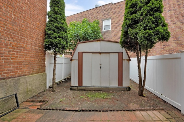 66-48 73rd Pl, Middle Village, NY 11379 - view of shed featuring a fenced backyard