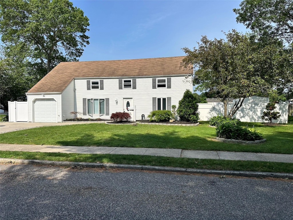 7 Lurcott Ln, Central Islip, NY 11722 - colonial home featuring a garage and driveway