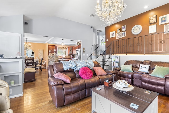 883 Saint James Pl, Franklin Square, NY 11010 - living area with a chandelier, stairway, and light wood finished floors