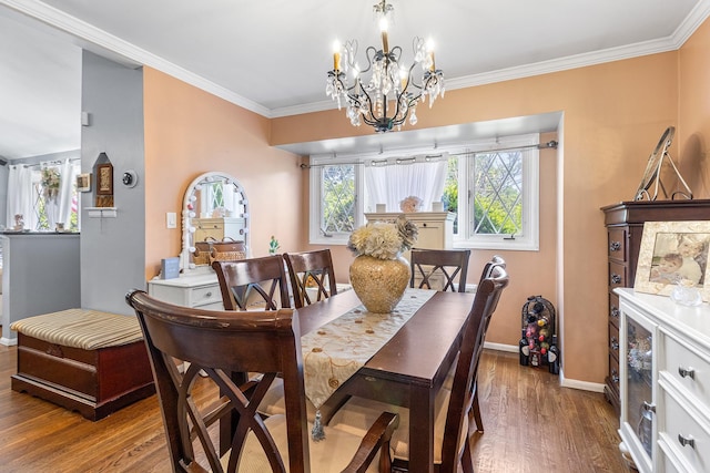 883 Saint James Pl, Franklin Square, NY 11010 - dining area featuring a chandelier, wood finished floors, and ornamental molding