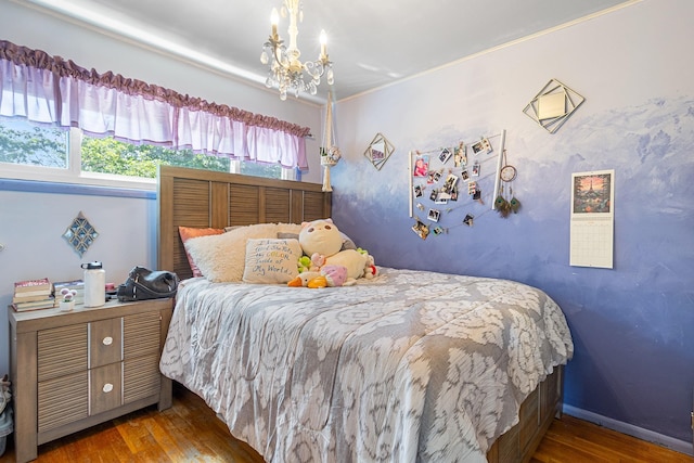 883 Saint James Pl, Franklin Square, NY 11010 - bedroom with wood finished floors, a chandelier, and ornamental molding