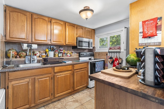 883 Saint James Pl, Franklin Square, NY 11010 - kitchen with electric range oven, stainless steel microwave, decorative backsplash, and dark countertops