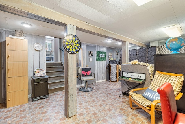 883 Saint James Pl, Franklin Square, NY 11010 - finished below grade area featuring stairs, brick patterned flooring, and wooden walls