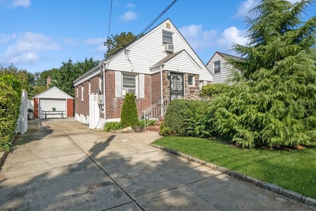 5 Charles St, Valley Stream, NY 11580 - bungalow-style house featuring an outdoor structure, brick siding, a garage, and a front yard
