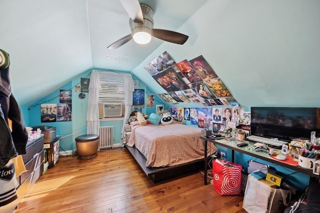 5 Charles St, Valley Stream, NY 11580 - bedroom featuring radiator, cooling unit, wood-type flooring, vaulted ceiling, and a ceiling fan