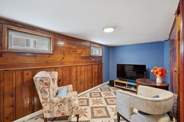 5 Charles St, Valley Stream, NY 11580 - living room featuring wood walls and baseboards