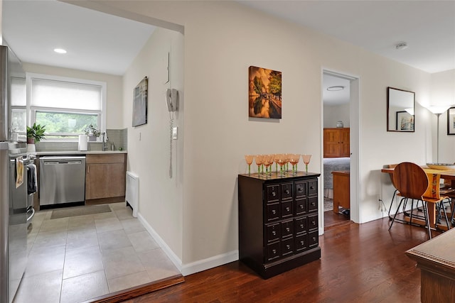 221 Schrade Unit 2G, Briarcliff Manor, NY 10510 - kitchen featuring appliances with stainless steel finishes, light countertops, recessed lighting, backsplash, and light wood-style floors